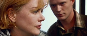 Movie still from “Dogville” (2003), directed by Lars von Trier – A woman and a man looking at each other; Close Up shot, Over the shoulder angle