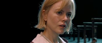 Movie still from “Dogville” (2003), directed by Lars von Trier – A person with blonde hair; Close Up shot, Over the shoulder angle