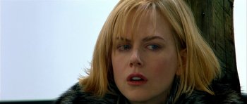 Movie still from “Dogville” (2003), directed by Lars von Trier – A woman's face in a fur coat; Close Up shot, Over the shoulder angle