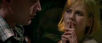 Movie still from “Dogville” (2003), directed by Lars von Trier – A man and a woman looking at one another; Close Up shot, Over the shoulder angle