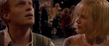 Movie still from “Dogville” (2003), directed by Lars von Trier – A man and a woman talking to each other in front of a crowd; Close Up shot, Over the shoulder angle
