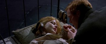 Movie still from “Dogville” (2003), directed by Lars von Trier – A man and a woman laying on a bed; Close Up shot, Low angle