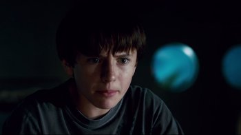 Movie still from “Dolphin Tale” (2011), directed by Charles Martin Smith – A young boy is staring into the camera; Close Up shot, Low angle