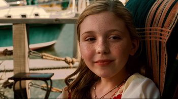 Movie still from “Dolphin Tale” (2011), directed by Charles Martin Smith – A young girl is posing for a picture; Close Up shot, High angle