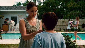 Movie still from “Dolphin Tale” (2011), directed by Charles Martin Smith – A young woman standing next to a young boy; Medium shot, Over the shoulder angle