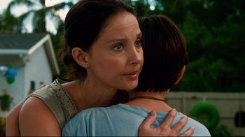 Movie still from “Dolphin Tale” (2011), directed by Charles Martin Smith – A person hugging another person; Close Up shot, Over the shoulder angle