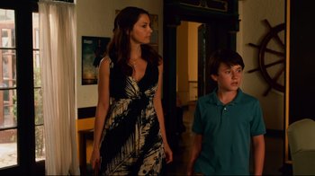 Movie still from “Dolphin Tale” (2011), directed by Charles Martin Smith – A woman and a young boy walking in a room; Medium shot, Over the shoulder angle