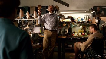 Movie still from “Dolphin Tale” (2011), directed by Charles Martin Smith – An older man standing in front of a table; Medium shot, Over the shoulder angle