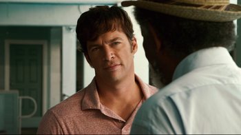 Movie still from “Dolphin Tale” (2011), directed by Charles Martin Smith – A man in a red shirt and a man in a straw hat; Close Up shot, Over the shoulder angle