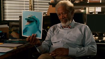 Movie still from “Dolphin Tale” (2011), directed by Charles Martin Smith – An older man holding up a picture of a dolphin; Close Up shot, Low angle