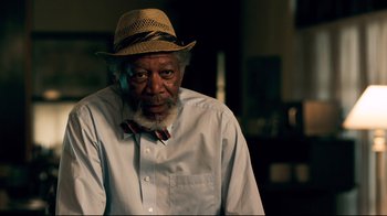 Movie still from “Dolphin Tale” (2011), directed by Charles Martin Smith – An older man wearing a hat and a bow tie; Close Up shot, Over the shoulder angle