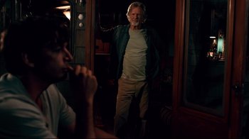 Movie still from “Dolphin Tale” (2011), directed by Charles Martin Smith – An older man standing next to a young man; Medium shot, Over the shoulder angle