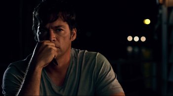 Movie still from “Dolphin Tale” (2011), directed by Charles Martin Smith – A person holding a cell phone to his ear; Close Up shot, Over the shoulder angle