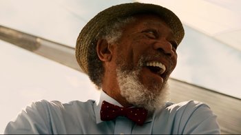 Movie still from “Dolphin Tale” (2011), directed by Charles Martin Smith – An older man wearing a hat and a bow tie; Close Up shot, Low angle