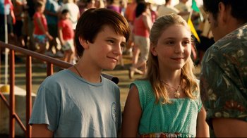 Movie still from “Dolphin Tale” (2011), directed by Charles Martin Smith – A boy and a girl standing next to each other; Close Up shot, High angle