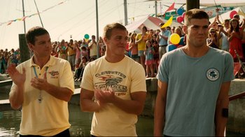 Movie still from “Dolphin Tale” (2011), directed by Charles Martin Smith – A group of young men standing next to each other in front of a crowd; Medium shot, Low angle