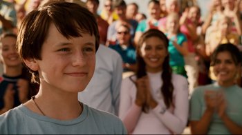 Movie still from “Dolphin Tale” (2011), directed by Charles Martin Smith – A group of people standing in front of each other; Close Up shot, Over the shoulder angle