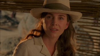 Movie still from “Dominion: Prequel to the Exorcist” (2005), directed by Paul Schrader – A person wearing a hat; Close Up shot, Over the shoulder angle