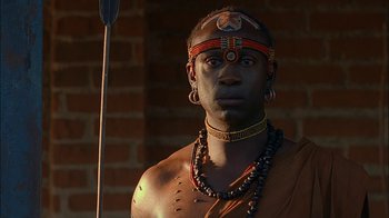 Movie still from “Dominion: Prequel to the Exorcist” (2005), directed by Paul Schrader – A man with a spear in his hand; Close Up shot, Over the shoulder angle