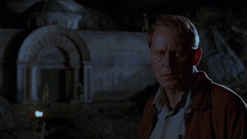 Movie still from “Dominion: Prequel to the Exorcist” (2005), directed by Paul Schrader – A person in a dark place; Close Up shot, Low angle