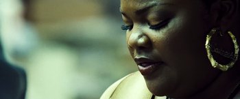 Movie still from “Domino” (2005), directed by Tony Scott – A woman's face with blue eye shadow; Extreme Close Up shot, Low angle