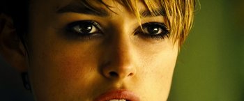 Movie still from “Domino” (2005), directed by Tony Scott – A woman's eyes and lips; Close Up shot, Over the shoulder angle