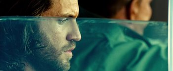 Movie still from “Domino” (2005), directed by Tony Scott – A man's face in the water; Close Up shot, Over the shoulder angle