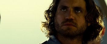 Movie still from “Domino” (2005), directed by Tony Scott – A person with long hair; Close Up shot, Low angle