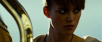 Movie still from “Domino” (2005), directed by Tony Scott – A woman's face and neck; Close Up shot, Low angle