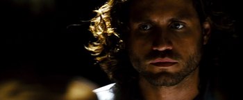 Movie still from “Domino” (2005), directed by Tony Scott – A person with long hair; Close Up shot, Low angle