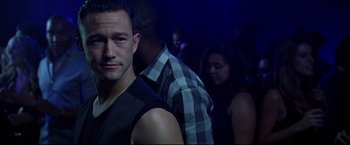 Movie still from “Don Jon” (2013), directed by Joseph Gordon-Levitt – A group of young men standing in front of a crowd; Close Up shot, Over the shoulder angle