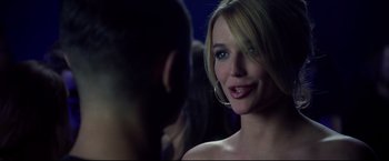 Movie still from “Don Jon” (2013), directed by Joseph Gordon-Levitt – A beautiful blonde woman standing in front of another woman; Close Up shot, Over the shoulder angle