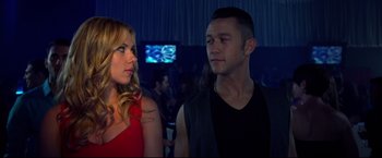 Movie still from “Don Jon” (2013), directed by Joseph Gordon-Levitt – A man and a woman standing next to each other in a room; Medium shot, Over the shoulder angle