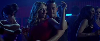 Movie still from “Don Jon” (2013), directed by Joseph Gordon-Levitt – A man and a woman are dancing in a nightclub; Medium shot, Low angle