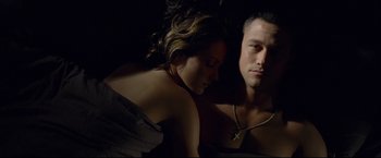 Movie still from “Don Jon” (2013), directed by Joseph Gordon-Levitt – A man and a woman laying on a bed together; Close Up shot, Overhead angle