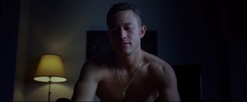 Movie still from “Don Jon” (2013), directed by Joseph Gordon-Levitt – A shirtless man with a cross on his neck; Close Up shot, High angle