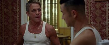 Movie still from “Don Jon” (2013), directed by Joseph Gordon-Levitt – A man talking to another man in a white shirt; Medium shot, Over the shoulder angle