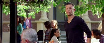 Movie still from “Don Jon” (2013), directed by Joseph Gordon-Levitt – A man standing in front of a group of people; Medium shot, Over the shoulder angle