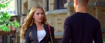 Movie still from “Don Jon” (2013), directed by Joseph Gordon-Levitt – A beautiful young woman wearing a black jacket; Medium shot, Over the shoulder angle