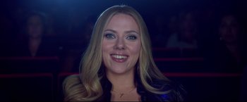 Movie still from “Don Jon” (2013), directed by Joseph Gordon-Levitt – A person smiling for the camera; Close Up shot, Low angle