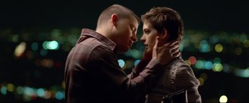 Movie still from “Don Jon” (2013), directed by Joseph Gordon-Levitt – Two young men touching each other's ears; Close Up shot, Over the shoulder angle