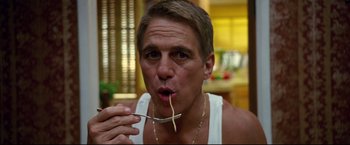 Movie still from “Don Jon” (2013), directed by Joseph Gordon-Levitt – A person with a fork in his mouth; Close Up shot, Low angle