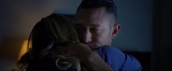 Movie still from “Don Jon” (2013), directed by Joseph Gordon-Levitt – A person kissing another person on the cheek; Close Up shot, Over the shoulder angle