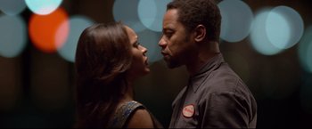 Movie still from “Don Jon” (2013), directed by Joseph Gordon-Levitt – A man and a woman kissing in front of lights; Close Up shot, Low angle