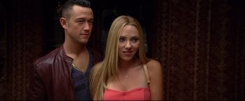 Movie still from “Don Jon” (2013), directed by Joseph Gordon-Levitt – A man standing next to a beautiful blonde woman; Close Up shot, Over the shoulder angle