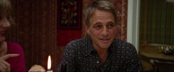 Movie still from “Don Jon” (2013), directed by Joseph Gordon-Levitt – A person sitting at a table; Close Up shot, Over the shoulder angle