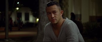 Movie still from “Don Jon” (2013), directed by Joseph Gordon-Levitt – A person sitting down wearing a sweater; Close Up shot, High angle