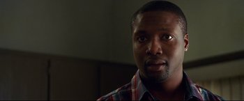 Movie still from “Don Jon” (2013), directed by Joseph Gordon-Levitt – A person wearing a plaid shirt; Close Up shot, Low angle