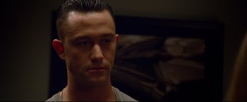 Movie still from “Don Jon” (2013), directed by Joseph Gordon-Levitt – A person wearing a white t - shirt; Close Up shot, Over the shoulder angle