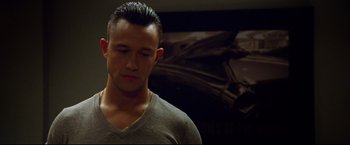 Movie still from “Don Jon” (2013), directed by Joseph Gordon-Levitt – A person wearing a gray t - shirt; Close Up shot, Low angle